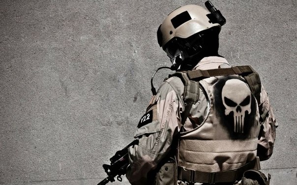 Military tactical gear with The Punisher’s skull symbol painted on the back
